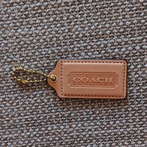 Coach bag tag color tan